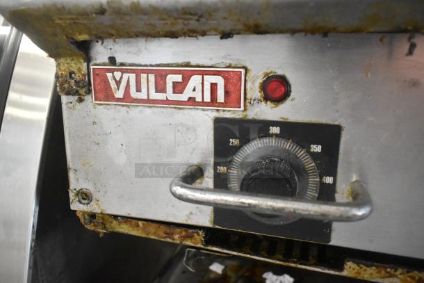 Vulcan stainless steel commercial gas griddle with thermostatic controls, showing brand logo and temperature dial, in used condition.