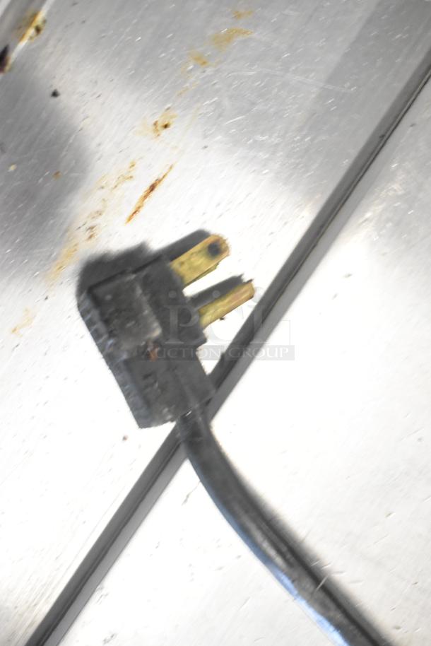 Beverage Air WTRCS52-1-60 stainless steel commercial chef base plug with visible wear marks on the surface.