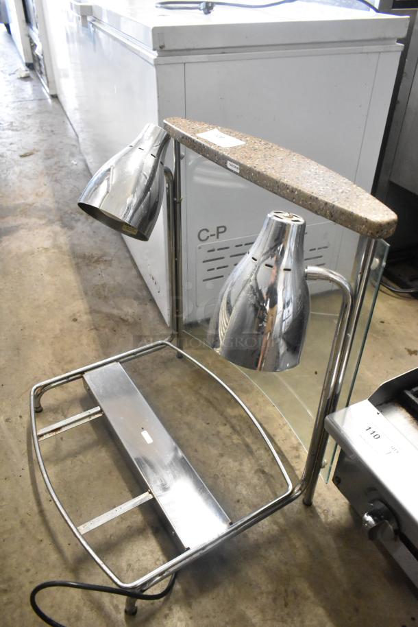 Vollrath CSV1201 metal countertop meat carving station, 120 volts, 1 phase, stainless steel with dual heat lamps.