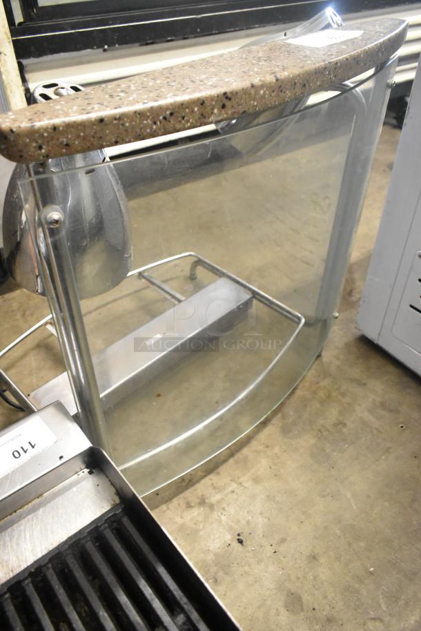 Vollrath CSV1201 metal countertop meat carving station, glass front, 120V, 1 Phase, used, with attached heat lamp.