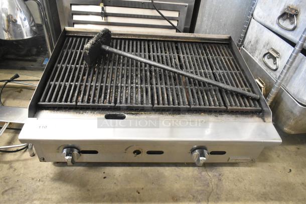 Migali stainless steel commercial countertop gas charbroiler grill, dual knobs, metal grate, used condition.