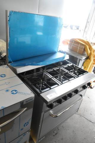 Stainless steel Mainstreet 541E36N 6-burner gas range, new, 36" with oven, backsplash, and 210,000 BTU capacity.