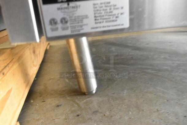 Stainless steel foot and label of Mainstreet 541E36N commercial range, indicating model and gas specifications.