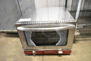 Brand new Avantco 177CO14 countertop convection oven, stainless steel, 0.8 cu. ft., scratch and dent, glass damage visible.
