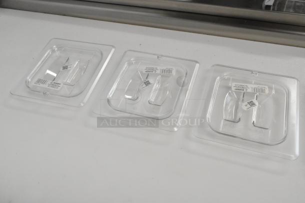 Lot of 5 brand new Cambro 60CWCH poly 1/6 size drop-in bin lids; slight scratches; clear plastic with labels.