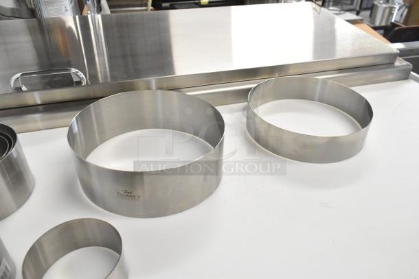 Brand new Fat Daddio's stainless steel round cake/food ring molds, minor dents, engraved logo, 13 available.