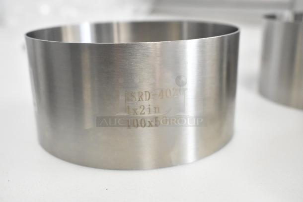 Fat Daddio's stainless steel round cake mold, 4x2in, marked "SSRD-4020," scratch and dent, 13 new pieces included.