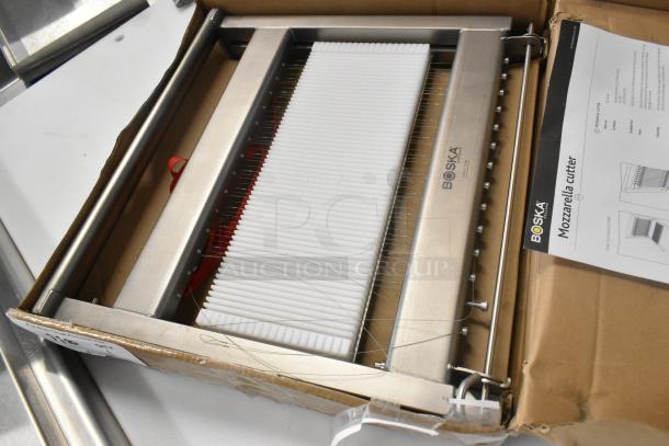 Brand new Boska 520060 Mozzarella Cheese Cutter, stainless steel, visible scratch and dent, includes original packaging and manual.