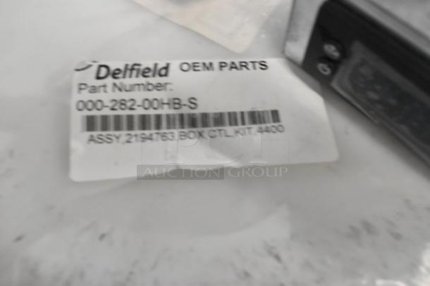 Brand new Delfield 000-282-00HB-S assembly kit, part number visible with barcode. Mint despite minor scratches.