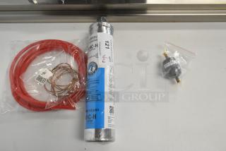 Brand new Hoshizaki 4HC-H water filter cartridge and Catchall C-032 filter drier. Includes red hose and copper coil.