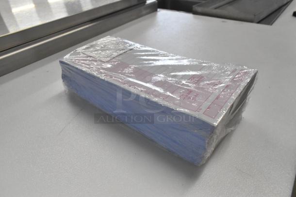 9 bundles of Choice 999948 guest checks in new scratch and dent condition, sealed in plastic, ready for use.