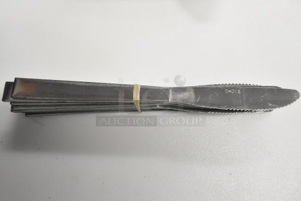 Bundle of 12 silverware pieces, including butter knives marked "CHOICE," secured with a rubber band. New scratch and dent condition.