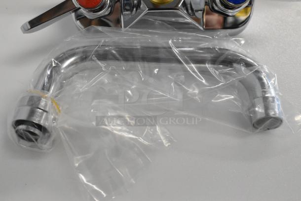 BRAND NEW Regency 600FW46 wall mount faucet with 6" swing spout, 4" centers. Scratch and dent condition. In original packaging.