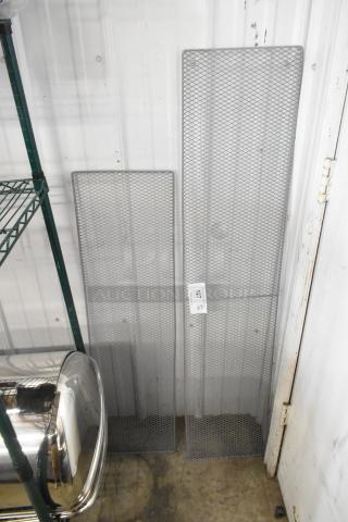 Two brand new mesh panels, scratch and dent condition, displayed against a wall, with a visible auction tag labeled "127".