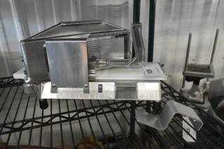 Brand new Choice 4071875TS 3/16" tomato slicer, scratch and dent condition; NSF certified, sturdy metal construction.
