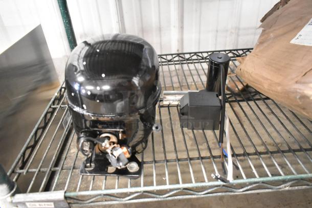 BRAND NEW Cubigel NUT90LR Compressor, 115-127 Volts, 1 Phase. Shows minor scratches; otherwise unused.