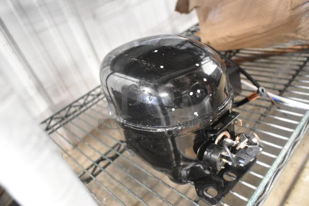 BRAND NEW SCRATCH AND DENT! Choice Cubigel NUT90LR Compressor, 115-127V, 1 Phase. Minor surface scratches visible.