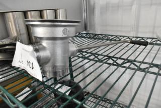 Brand new T&S metal drain by Choice on shelf, slight scratch and dent, includes threaded fittings and lever.