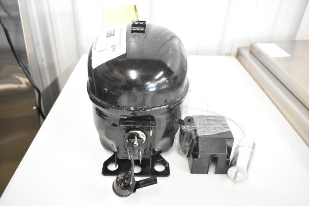 Brand new Cubigel NUT70NR compressor with minor scratches and dents. 115-127 volts, 1 phase, tagged "Choice."