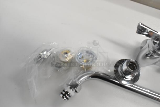Brand new Choice faucet with handles, chrome finish. Includes mounting hardware. Scratch and dent condition.