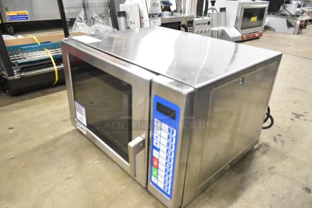 Brand new Solwave SWA21T stainless steel commercial microwave, push button controls, 208/240V, minor dents visible.