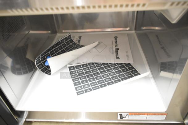 Brand new Solwave SWA21T commercial microwave interior with owner's manual and control labels, 208/240V, stainless steel.