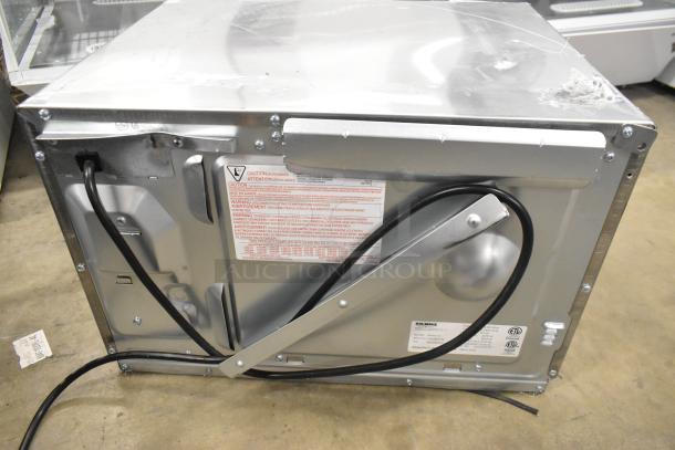 New Solwave SWA21T stainless steel microwave, 2025 model, 208/240 V. Scratch and dent condition, rear view with caution labels.
