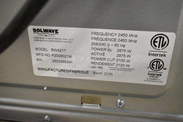 Alt Text: Solwave SWA21T microwave label shows model, serial number, power specifications, and March 2025 manufacture date.