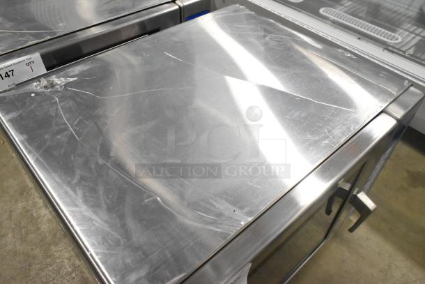 Brand new Solwave SWA21T commercial microwave, medium-duty, stainless steel, with push button controls. Visible scratches on surface.
