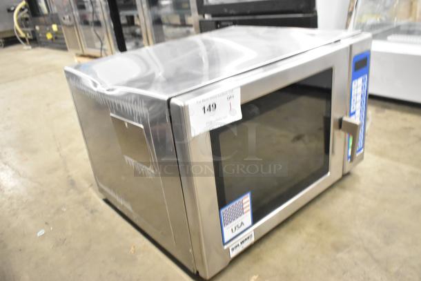 Brand new Solwave SWA21T microwave, stainless steel, push button controls, slight dent visible, 208/240V, USA-made.