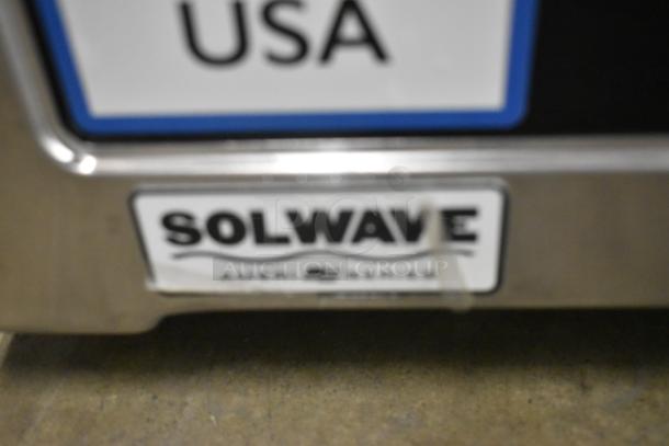 Solwave SWA21T stainless steel commercial microwave, medium-duty, push button controls, new scratch and dent, model tag visible.