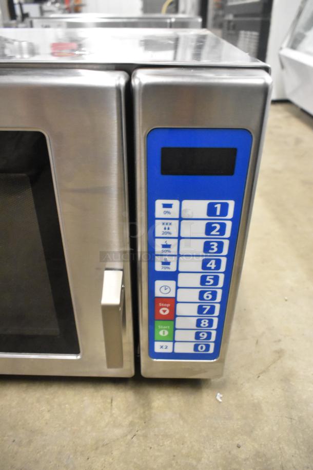 Brand new Solwave SWA21T microwave; stainless steel, push button controls, 208/240V, medium-duty, visible minor scratches.