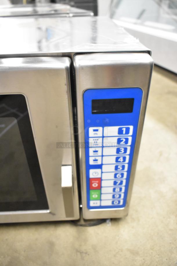 Brand new 2025 Solwave SWA21T stainless steel commercial microwave with push button controls, visible minor scratches.