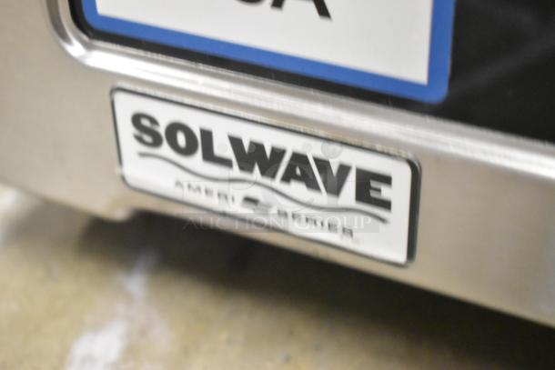 Brand new Solwave SWA21T Ameri-Series commercial microwave with visible branding, scratch and dent, push button controls.