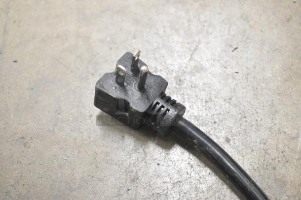 Power plug for Avantco 184T140 conveyor toaster, 120 volts, shown on a concrete surface. Item is brand new.