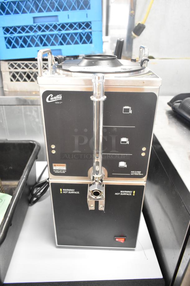 Brand new Curtis GEM-3-5 1.5 gallon satellite coffee server with warmer stand. Features scratch and dent, 120V, 1 phase.