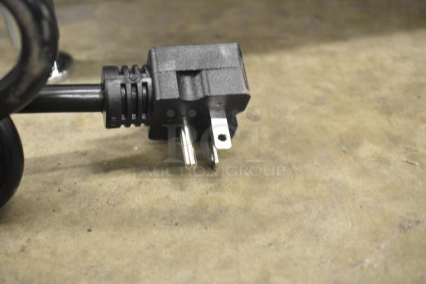 Close-up of a power plug for the Avantco 184T140 commercial toaster. Black cord, standard 120V plug.
