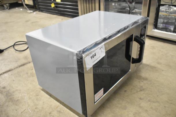 Brand new Panasonic NE-1054F stainless steel commercial microwave, 2025 model, 120V, with scratch and dent, item #164 label visible.