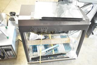 Avantco 177HDC26 26" heated display case, new scratch and dent, 3 shelves, sliding doors, 120V, 1 phase.