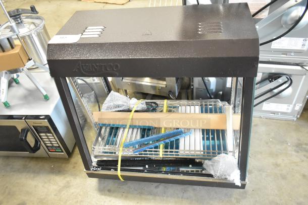 Avantco 177HDC26 26" heated display case, new condition, three shelves, sliding doors, visible label, 120V, 1 Phase.