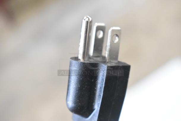 Close-up of a three-prong plug for the Avantco 177CO16 half-size countertop convection oven, 2024 model, 120 volts.