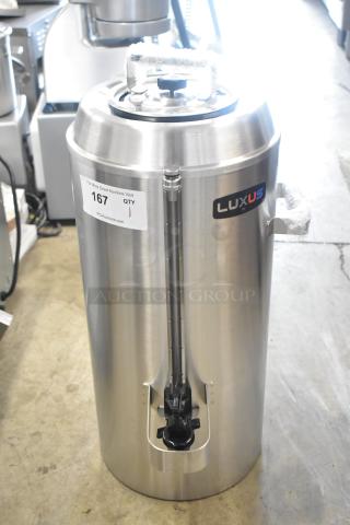 Brand new Fetco TPD-30 Luxus 3-gallon stainless steel coffee dispenser with visible scratch and dent. Model TPD-30.