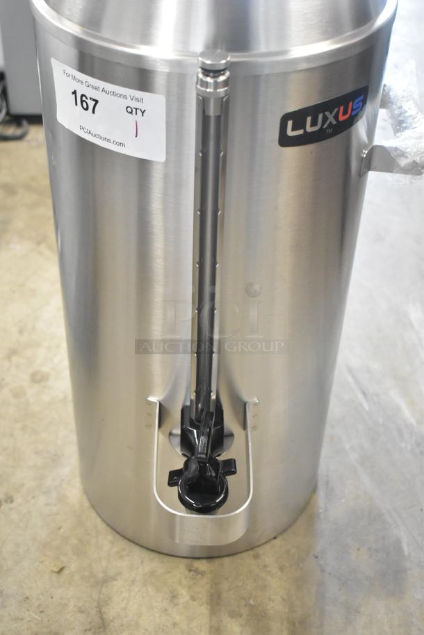 Brand new Fetco TPD-30 Luxus stainless steel 3-gallon coffee dispenser, scratch and dent. Auction tag 167 visible.