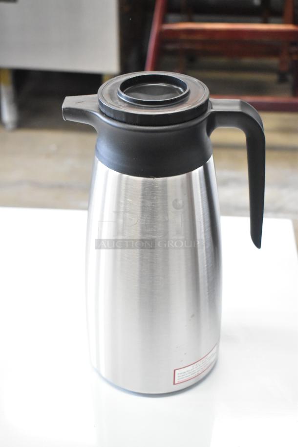 QINS SVP-1900A-N stainless steel thermal pitcher, brand new, minor scratches, black lid and handle, 2 times your bid.