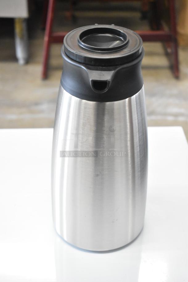 Brand new QINS SVP-1900A-N stainless steel thermal pitcher, scratch and dent condition, black lid, auction item.