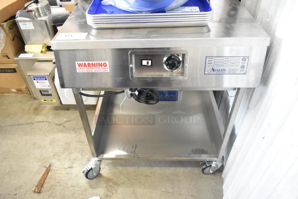 Brand new Avalon AFG34T-H 24"x34" stainless steel donut glazer with under shelf, commercial casters, 120V, 1 phase.