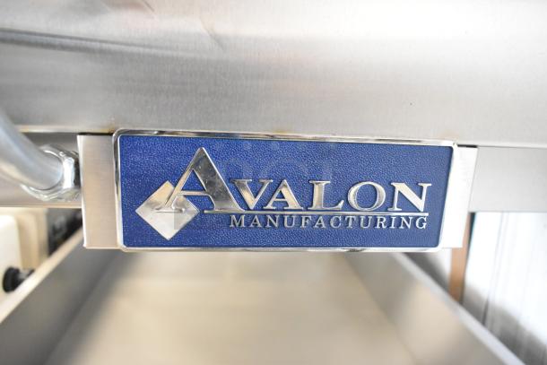Brand new Avalon AFG34T-H 24" x 34" stainless steel heated donut glazer, features under shelf, commercial casters, 120V, 1 phase.