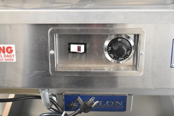 Brand new Avalon AFG34T-H stainless steel heated donut glazer, 24"x34", with under shelf, commercial casters, 120V.