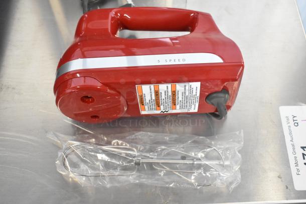 Brand new KitchenAid KHM512ER hand mixer in Empire Red. Features 5 speeds, stainless steel beaters. Scratch and dent condition.