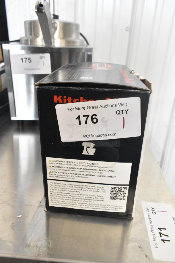 KitchenAid KHM512ER Ultra Power 5-Speed Hand Mixer in Empire Red, new scratch and dent condition, with stainless steel turbo beaters. Box displays QR code and Proposition 65 warning label.